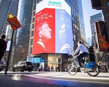 A large electronic display posting the odds of Donald Trump or Kamala Harris winning the 2024 US election