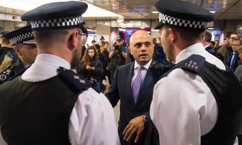 Sajid Javid with police officers during a visit to Angel tube station in March to announce plans to increase stop and search powers.