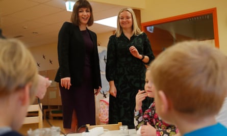Bridget Phillipson, left, talks with a teacher during her visit to the Viimsi kindergarten in Estonia