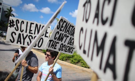 Alexius Marcano and other protesters gather near the office of U.S. Sen. Marco Rubio (R-FL) to ask him to take action to address climate change on August 13, 2013 in Miami, Florida. The event is part of a national movement to inform Congressional members who they say don’t believe in climate change even though a majority of Americans, 97% of climate scientists, NASA, NOAA and the National Academy of Sciences all say a change is happening in the climate.