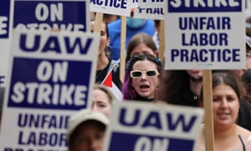 Person wearing sunglasses surrounded by strike signs