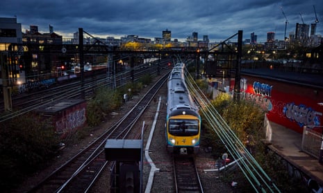 A Trans Pennine Express train shortly after departing Manchester Piccadilly station at dusk. 