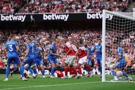 Arsenal’s Jurrien Timber (left, on the ground) heads his side into the lead.
