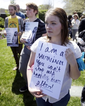 Students at Brigham Young University stand in solidarity with rape victims at a campus demonstration.
