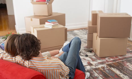 Couple in new home surrounded by boxes