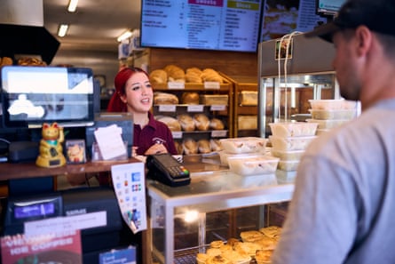 University student Sena, working behind the counter.