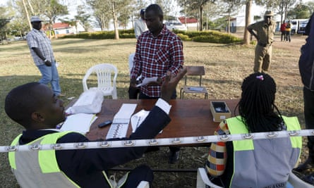 A voter’s identity is verified at a polling station in Kirihura, western Uganda.