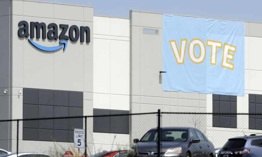 A banner encouraging workers to vote in labor balloting is shown at an Amazon warehouse in Bessemer, Alabama, late March.