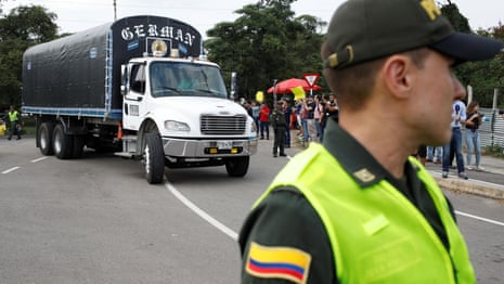 Aid trucks arrive at Venezuela border as Maduro tries to woo security forces – video 