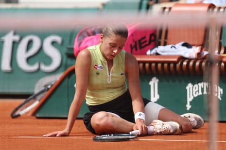 Maja Chwalinska falls to the floor as she struggles against Maria Sakkari