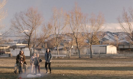 A family look up at the sky excitedly in The Killing of Two Lovers.