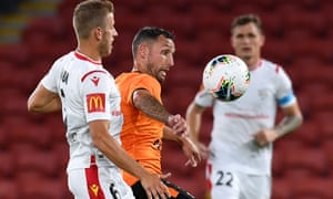 Scott McDonald of the Roar (centre) and Stefan Mauk of Adelaide United