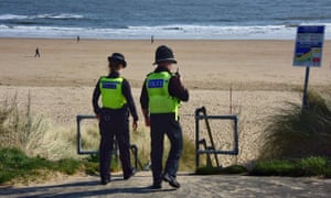Police officers patrol Tynemouth Longsands beach in North Tyneside, as the public is urged to resist the temptation to enjoy the sunny weather outdoors