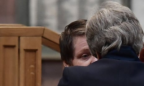 Theresa May speaks to Lyra McKee’s partner Sara Canning as she arrives to attend the funeral service.