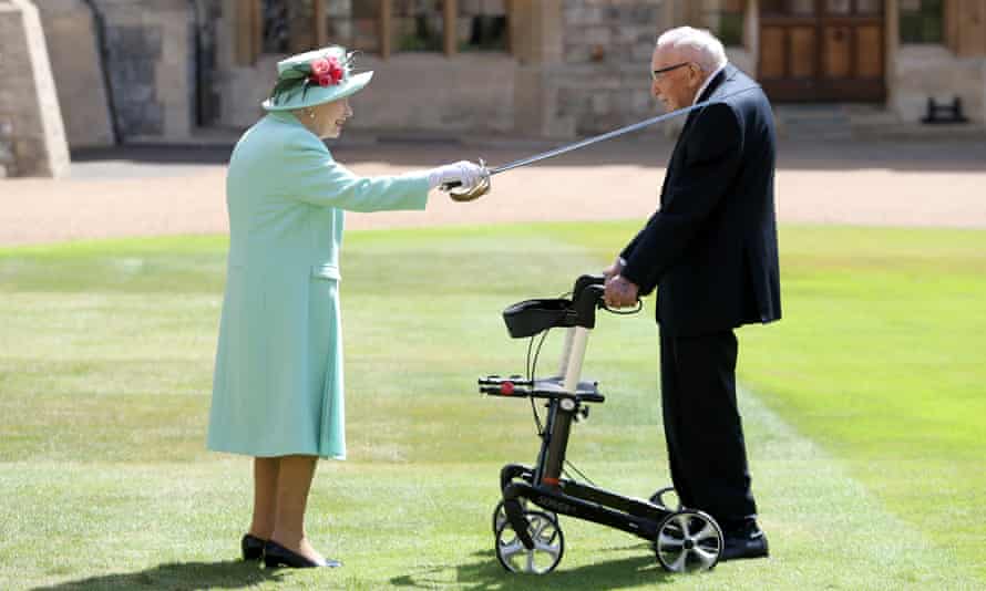Cpt Sir Tom Moore being knighted by the Queen in the grounds of Windsor Castle