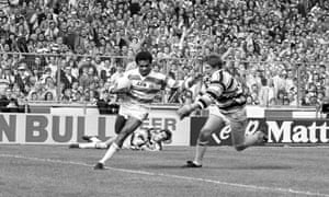 Wigan’s John Ferguson (left) hands off the Hull captain Lee Crooks on his way to scoring his side’s fifth try.