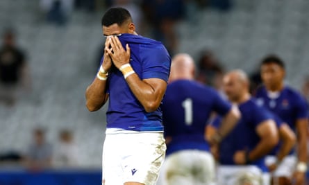 Nigel Ah Wong hides his face in his shirt after Samoa's late defeat to England.