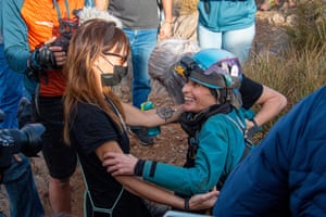 The elite athlete, mountaineer and climber Beatriz Flamini (right) leaves a cave