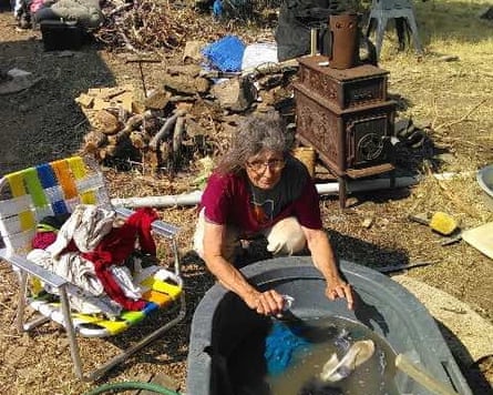 A female doing laundry by manus extracurricular successful a tub