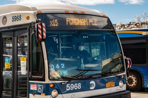 A Metropolitan Transportation Authority (MTA) driver wears a protective mask while driving a bus in the Bronx borough of New York, U.S., on Thursday, April 2, 2020.