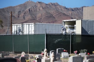 Inmates at the El Paso County Detention Center prepare to load the bodies into a refrigerated temporary morgue on November 16.