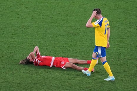 Tunisia's Hannibal Mejbri, left, reacts as after a match against Sweden.