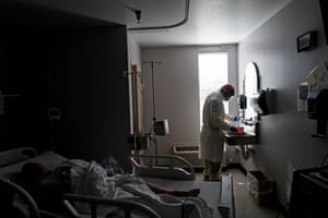 A member of the medical staff wearing full PPE prepares a disinfectant solution to wipe a deceased patient in the Covid-19 intensive care unit at the United Memorial Medical Center in Houston on June 30th.