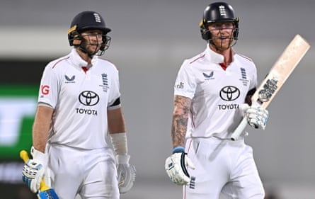 Joe Root (left) and Ben Stokes leave the field at the end of the second session on day one of the second Ashes Test in Brisbane