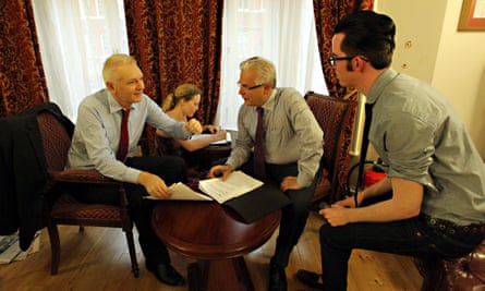 Julian Assange with legal advisers in the Ecuadorian embassy in London