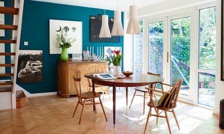 Vintage Ercol chairs surround a G-Plan table, with lights by Secto, from skandium.com.
