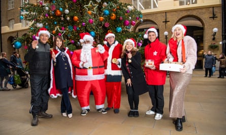 Not-so-secret Santa … at the Action for Children winter cabin. (From left) Larry Lamb, Alex Jones, Harry Redknapp, Kelsey Parker, Luca Bish and Louise Boyce.