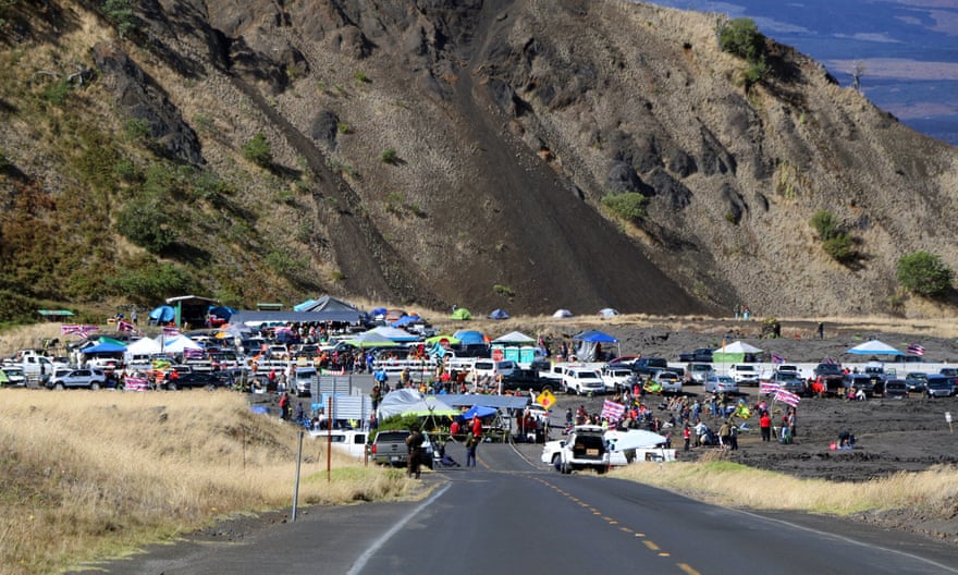 People who are against the construction of a Hawaii telescope block the roadway to the top of Mauna Kea on Thursday.