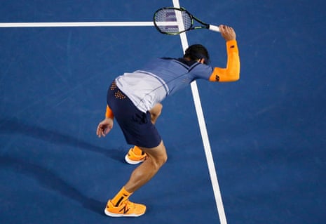Milos Raonic takes his frustration out on his racquet.