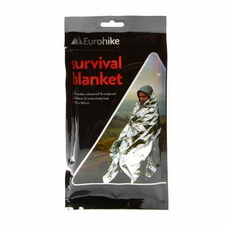 A Eurohike Survival Blanket in its black tear open packet.