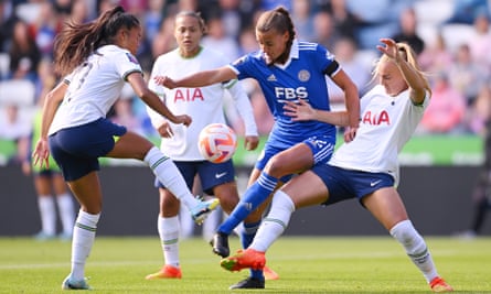 Ashleigh Plumptre of Leicester City battles for possession with Asmita Ale (left) and Molly Bartrip of Tottenham Hotspur.