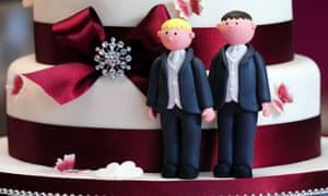 Two grooms on a wedding cake