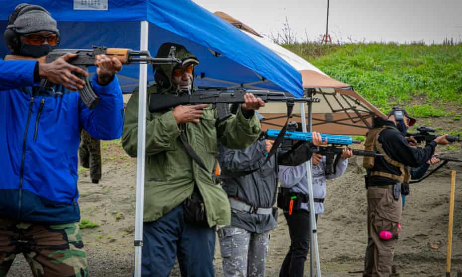 Black novice gun owners line up for a shooting drill during a Black Gun Owners Association training at the Richmond Rod & Gun Club in Richmond, California.
