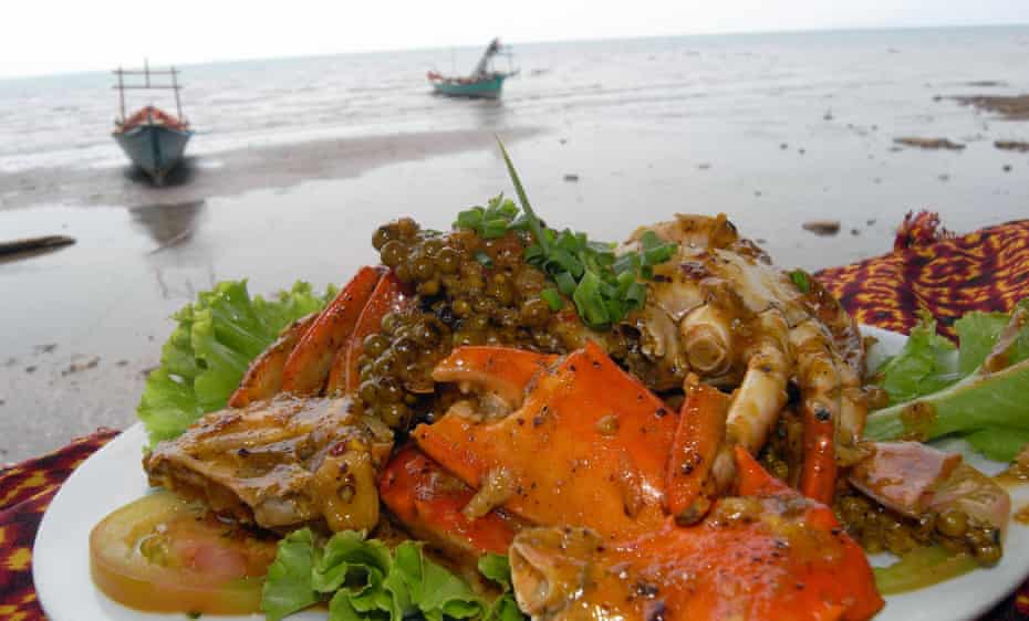 Fresh Kep crab in Kampot pepper on the beach.