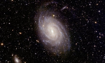 A white spiralling light in a dark starry sky