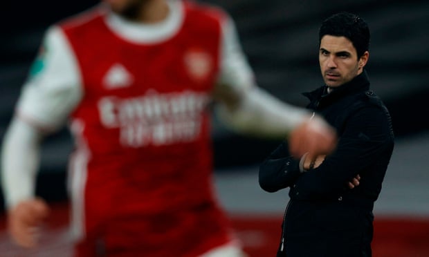 Mikel Arteta looks on as his Arsenal side slip to a 4-1 defeat against Manchester City.