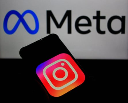 The Meta logo with Instagram logo on a smartphone in the foreground