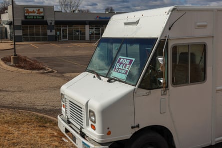 a white truck parked with a sign in the window