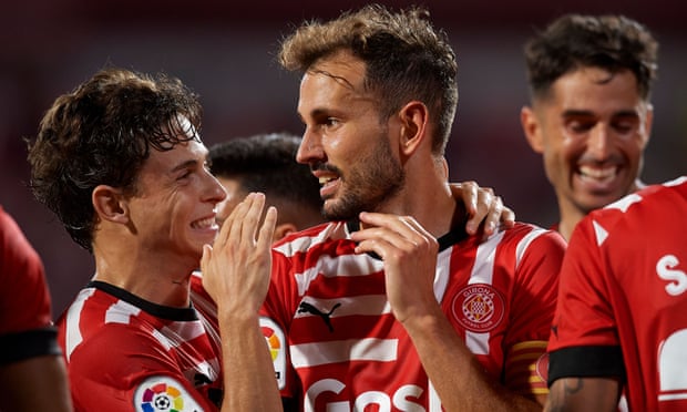 Cristhian Stuani (centre) celebrates after opening the scoring for Girona against Getafe.