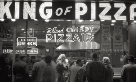 black and white photo shows pizzeria called King of Pizza