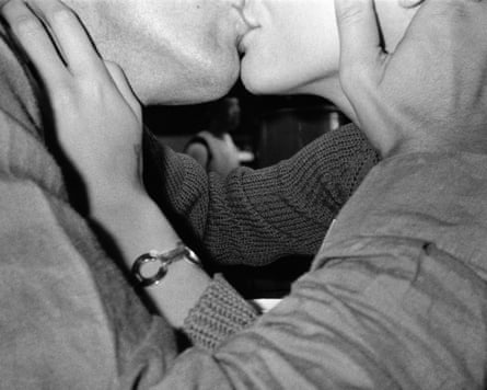 A couple kissing.