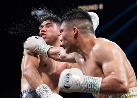 Isaac Cruz, right, lands a punch on Omar Salcido during their fight on Saturday in Las Vegas.
