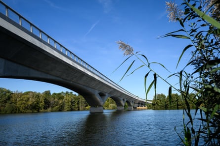 A bridge crossing over a lake seen from below