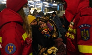 Russia-Ukraine war latest news: Putin’s troops land in Kharkiv as Zelenskiy says ‘they have orders to erase us all’ – live | World news 1 A Romanian emergency rescue service SMURD volunteers chat near a group of people who fled the conflict, and arrived in Romania, on March 1, 2022 in Isaccea, Romania.