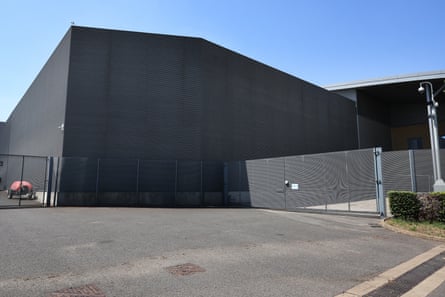 A large, grey building with no windows