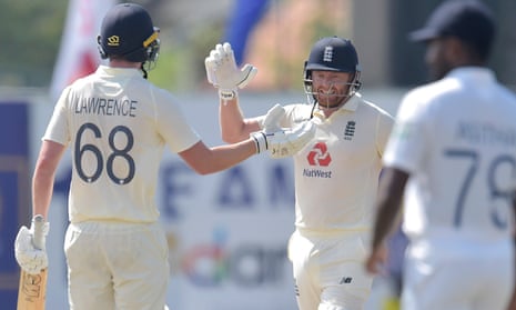 Dan Lawrence and Jonny Bairstow celebrate England’s seven wicket victory.